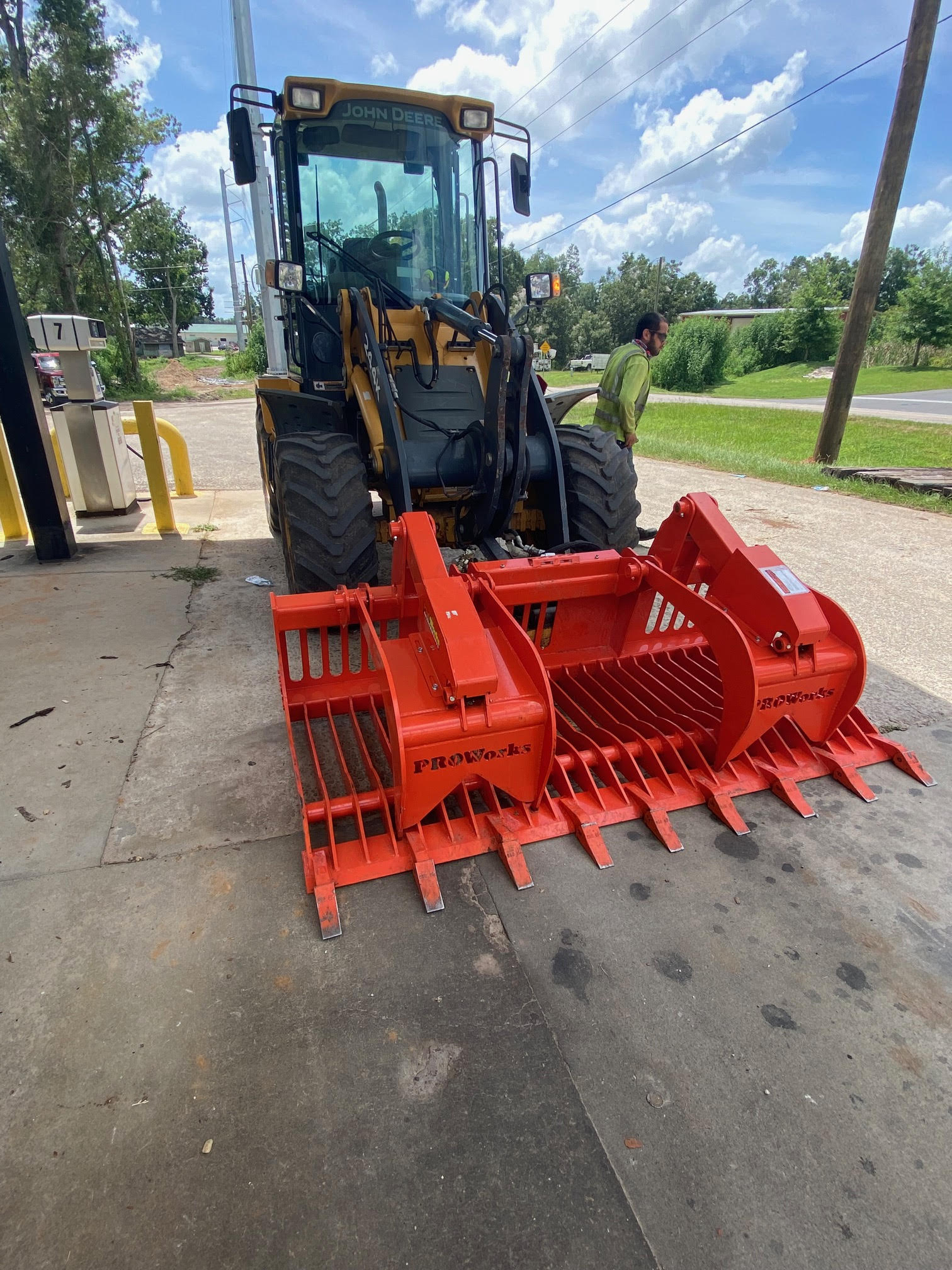 John Deere loader with PROWorks grapple attachment